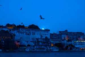 Full moon over Udaipur City Palace